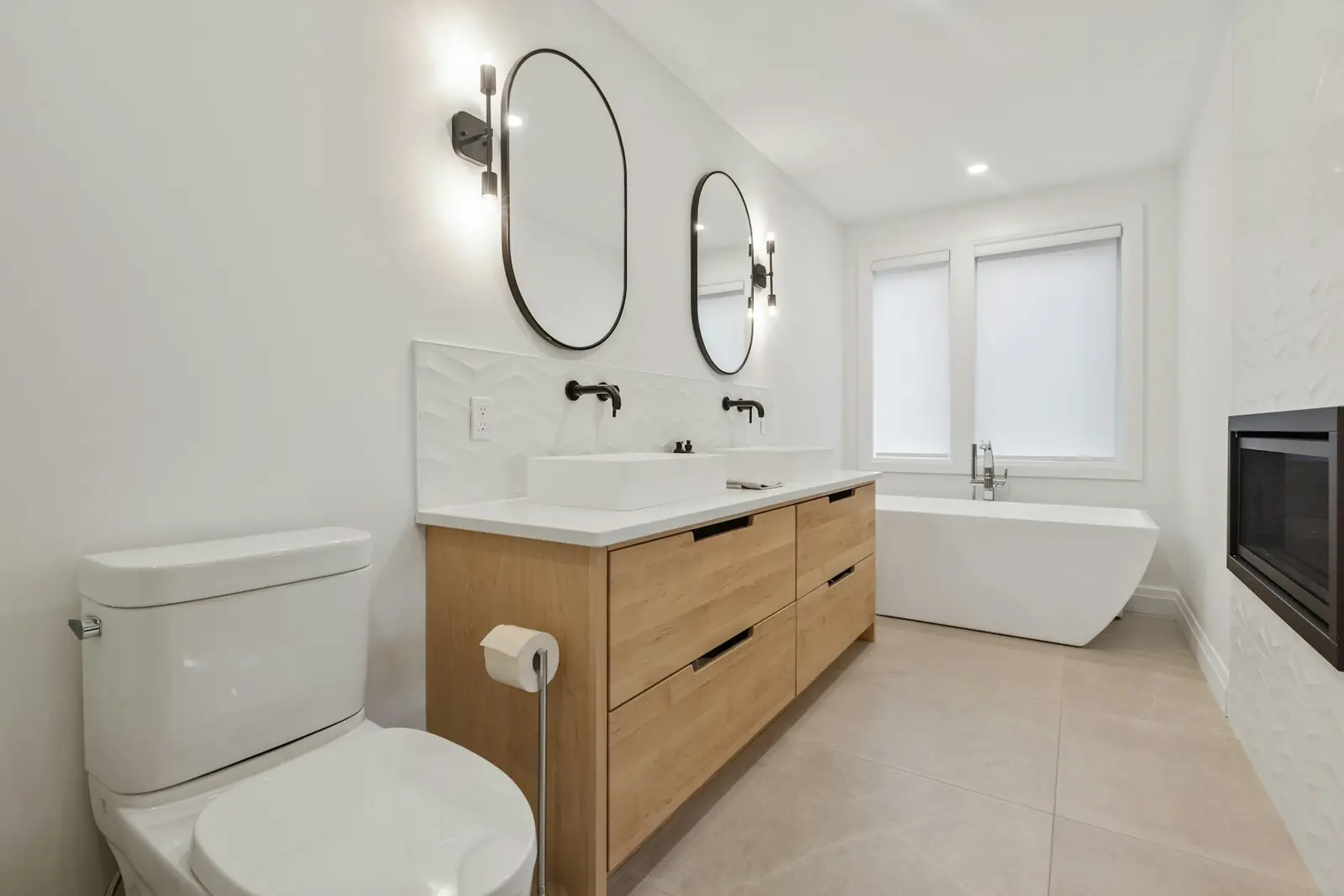 Bathroom with an oak vanity unit, close-coupled toilet and bath