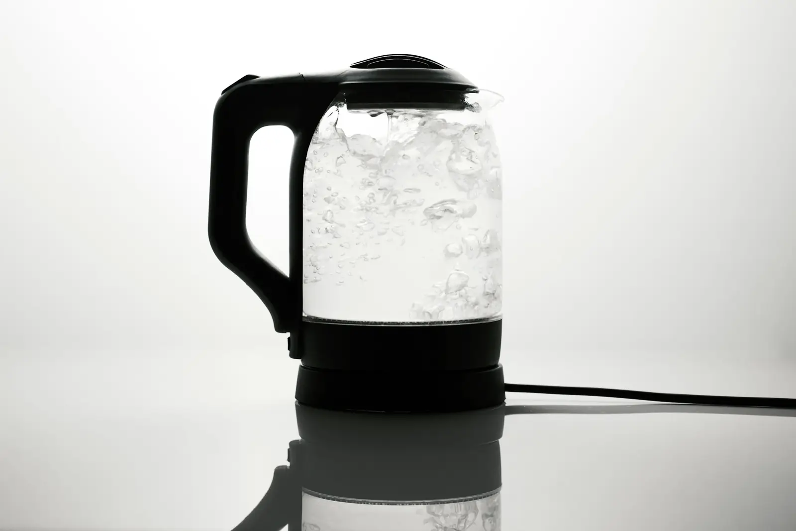Glass kettle with boiling water