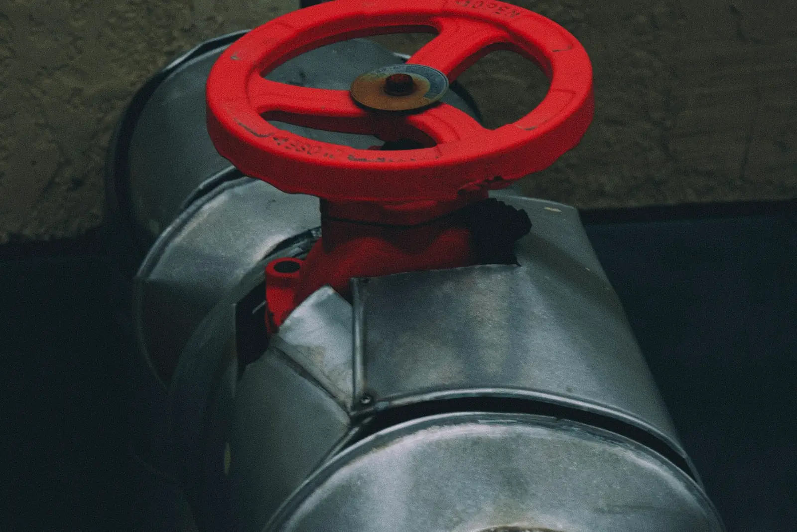 Red valve wheel on a metal pipe